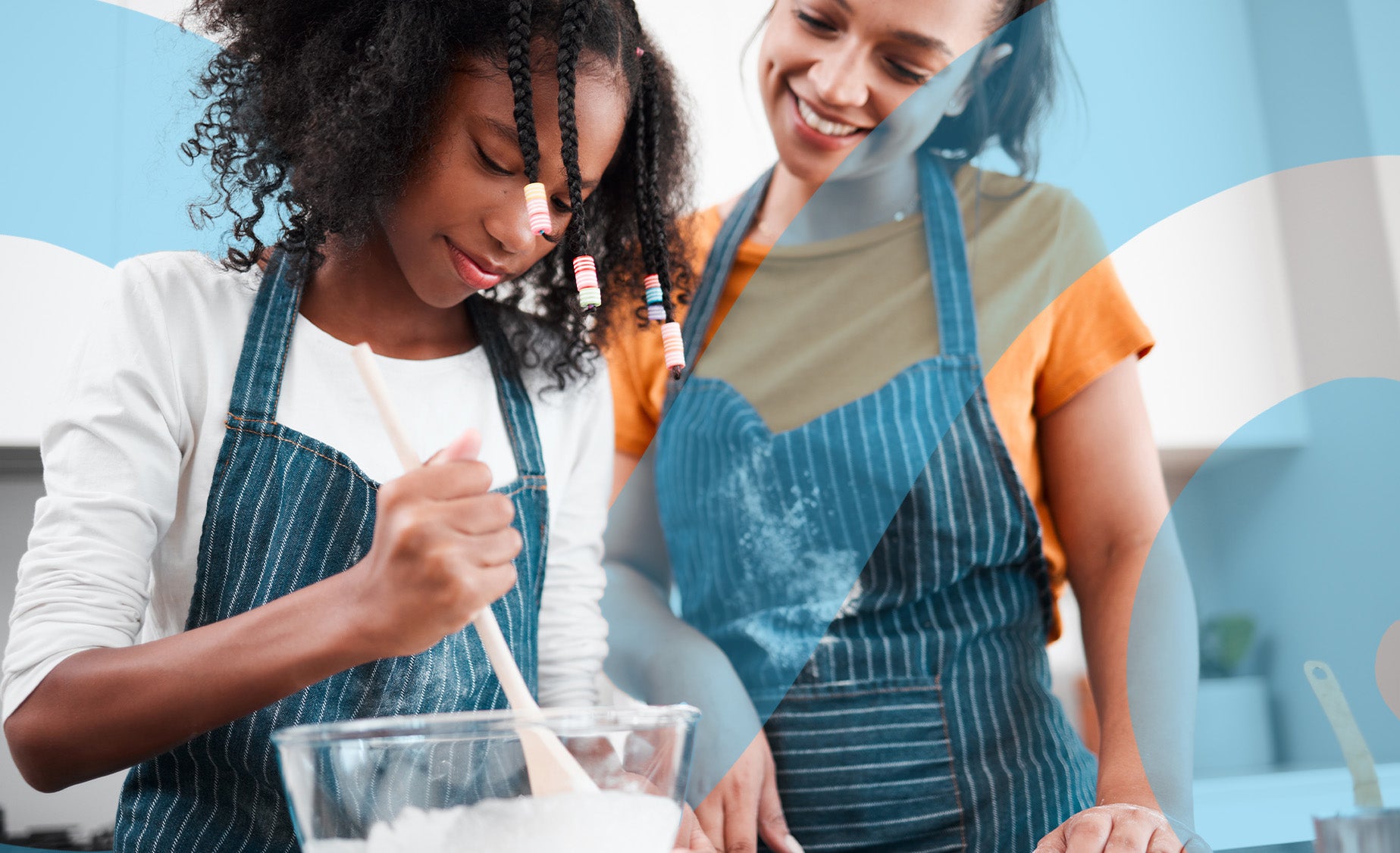A mother and child having fun in the kitchen decorating an Easter cupcake