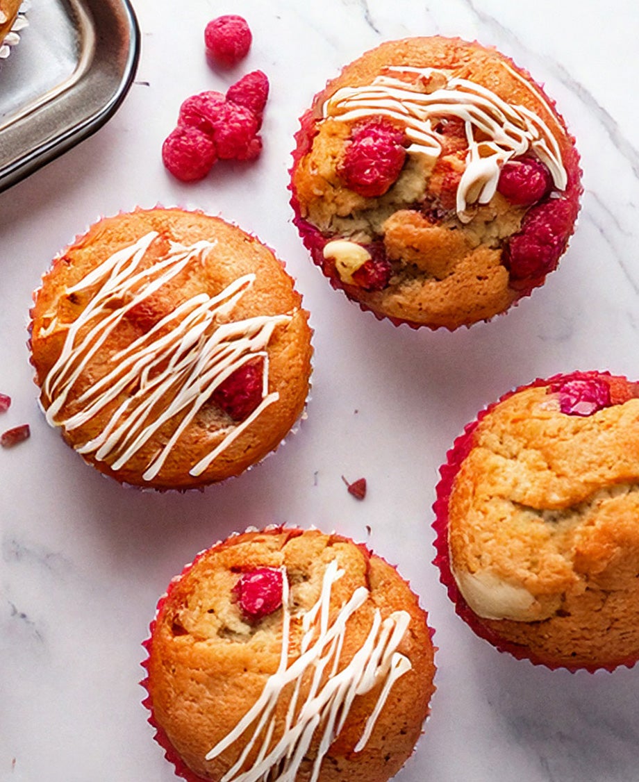 Raspberry and white chocolate muffins on a marble worktop