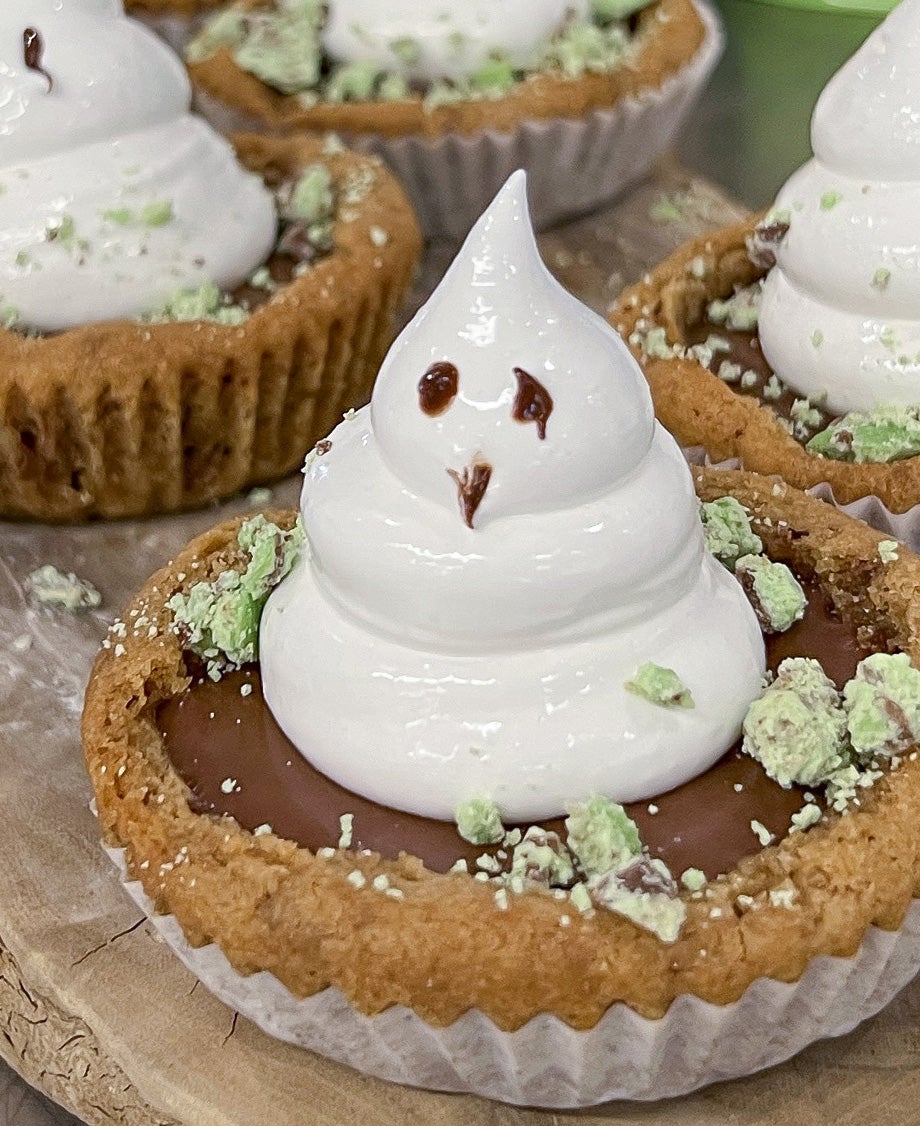 Spookie Aero cookie cups topped with meringue ghosts and crushed mint chocolate on cookie base 