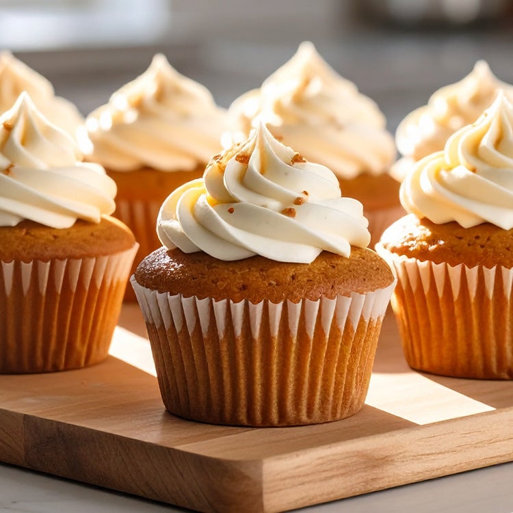 festive gingerbread cupcakes topped with Milkybar® white chocolate buttercream