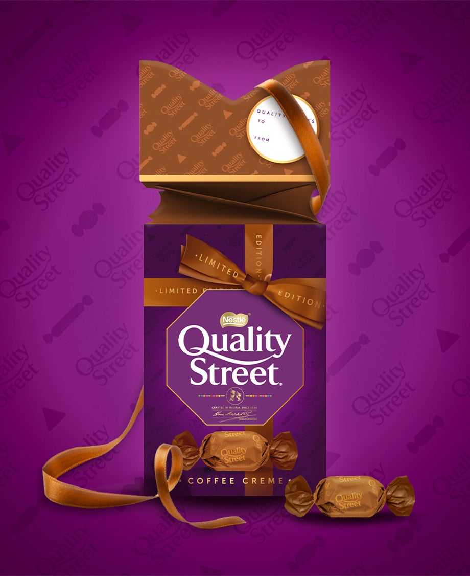 Special edition Quality Street Coffee Creme carton against a branded purple background