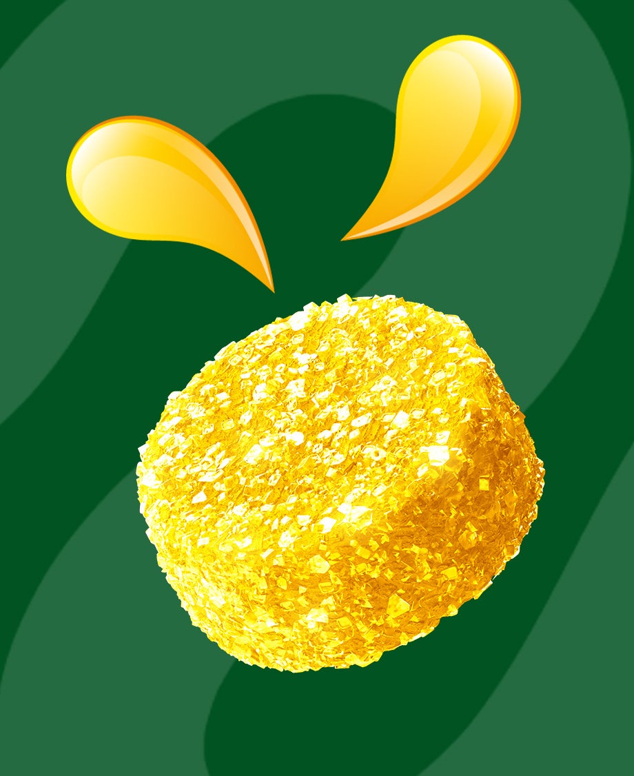 Yellow Fruit Pastille sweet on green background 
