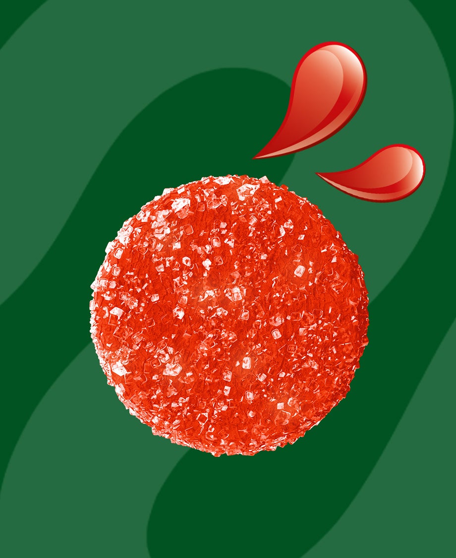 Red Fruit Pastille sweet on green background
