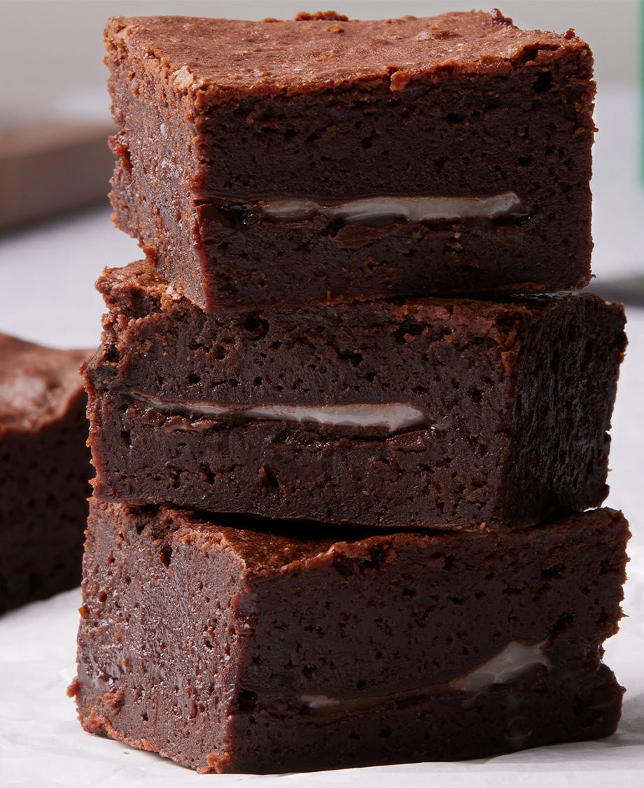 Stack of dark chocolate brownies with a mint fondant filling