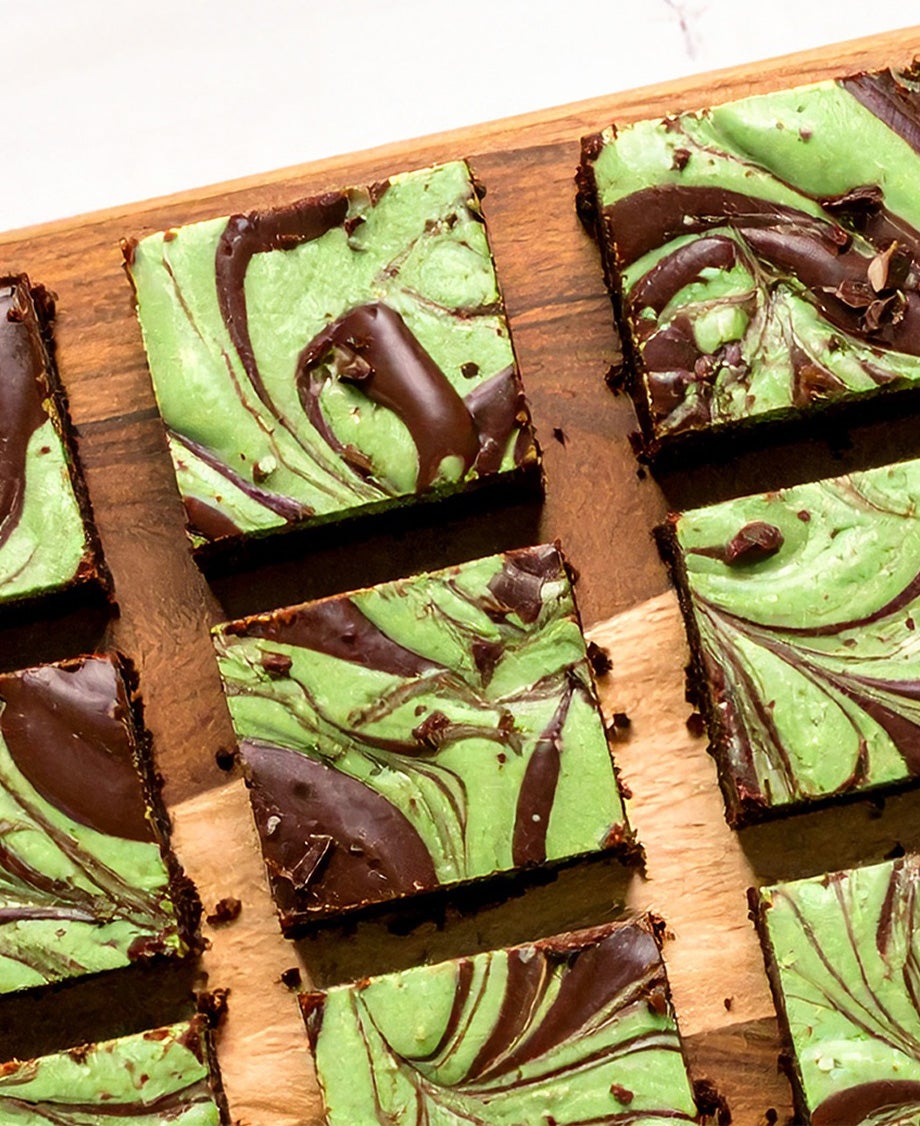 Green and brown marbled chocolate mint Aero traybake sliced into squares on a wooden board