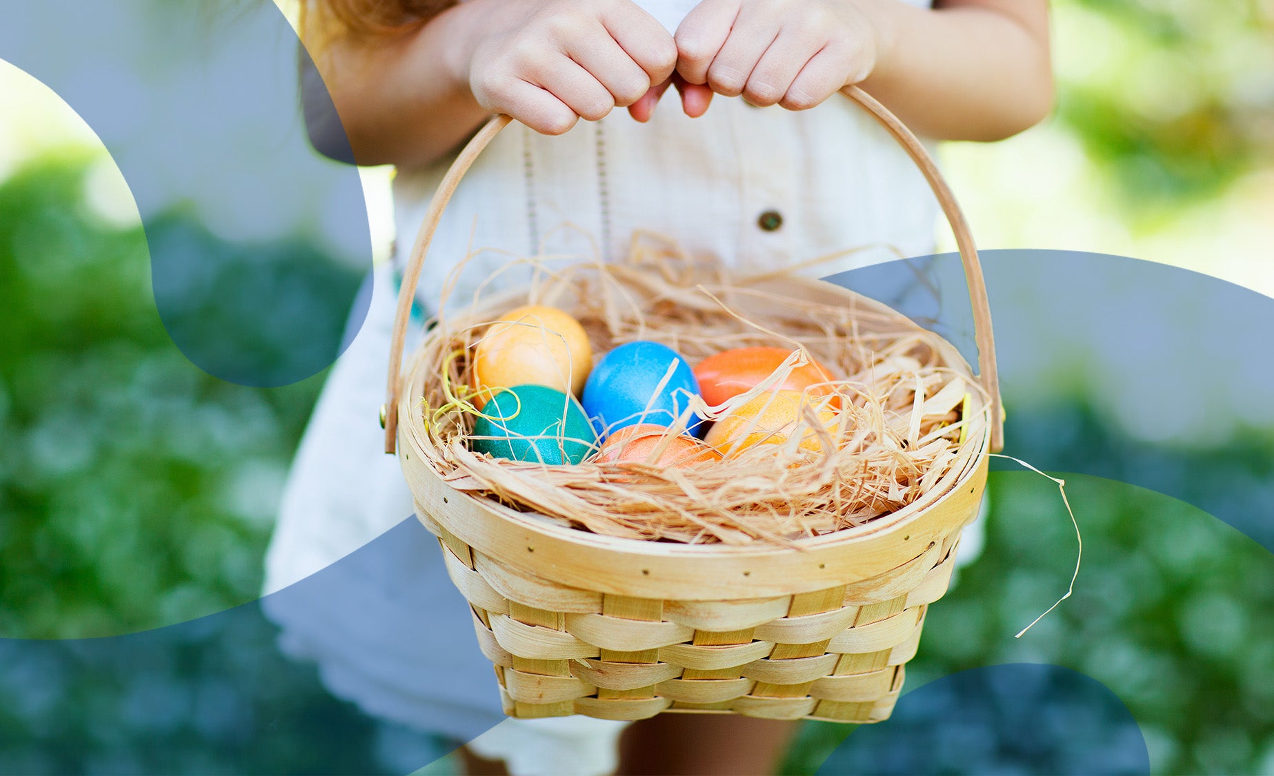  A child holds a basket of colourful decorated eggs 