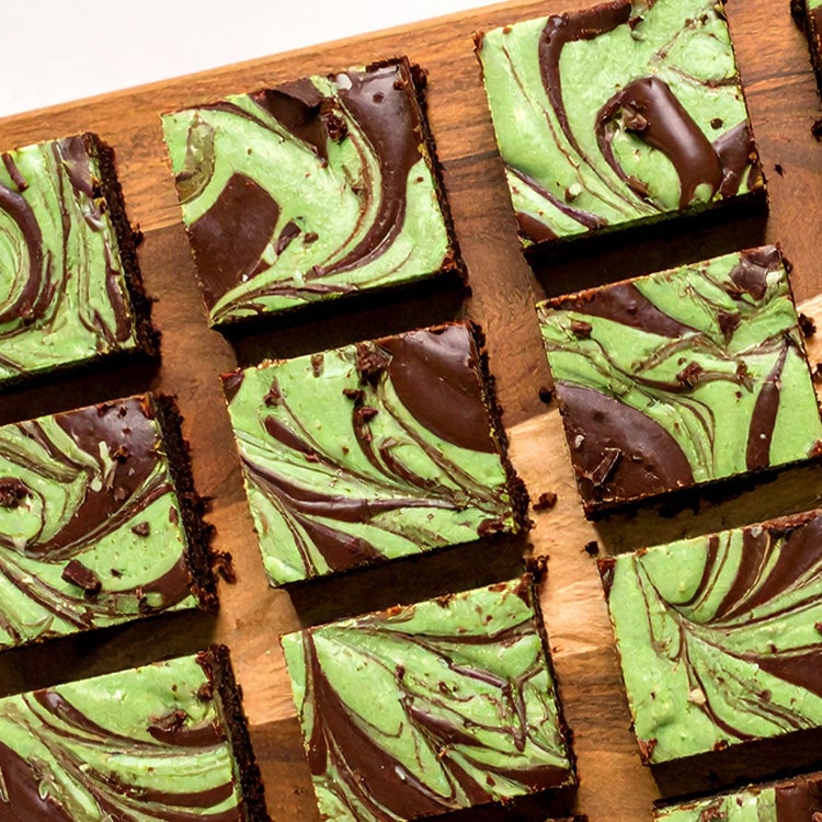 Green and chocolate marbled mint Aero traybake sliced into squares on a wooden board