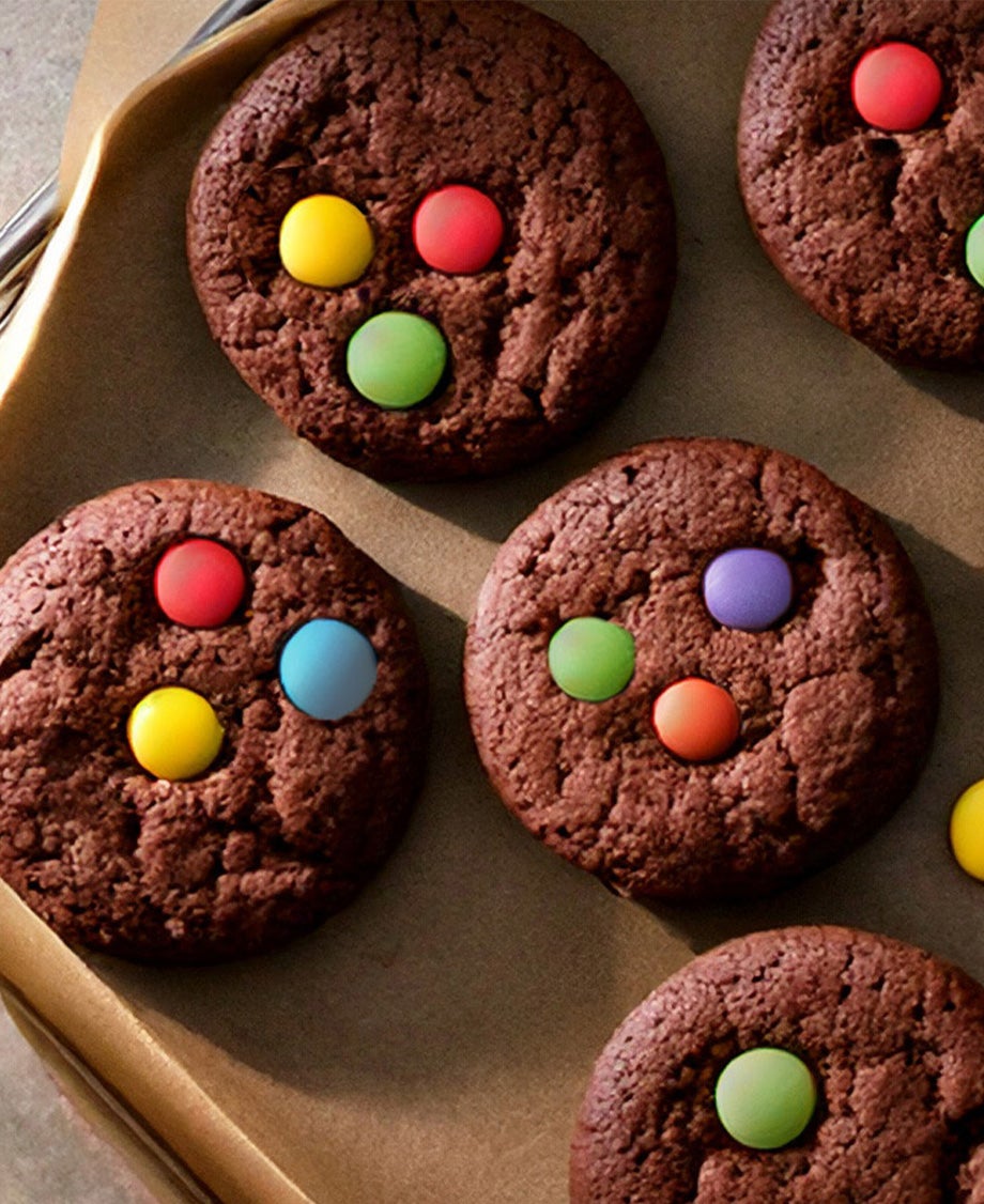 Chocolate cookies with smarties on top