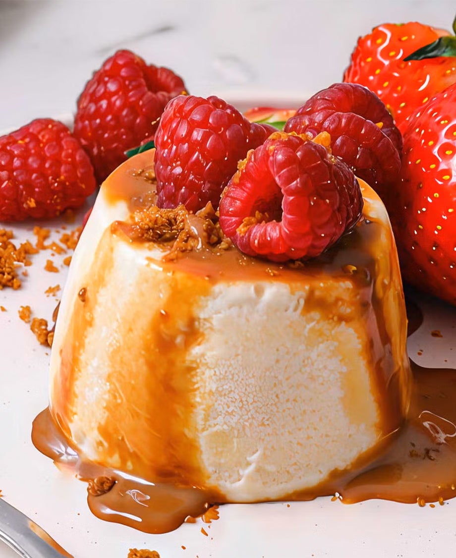  Upside-down Milkybar mousse pot drizzled with caramel sauce and dressed with fresh raspberries and strawberries