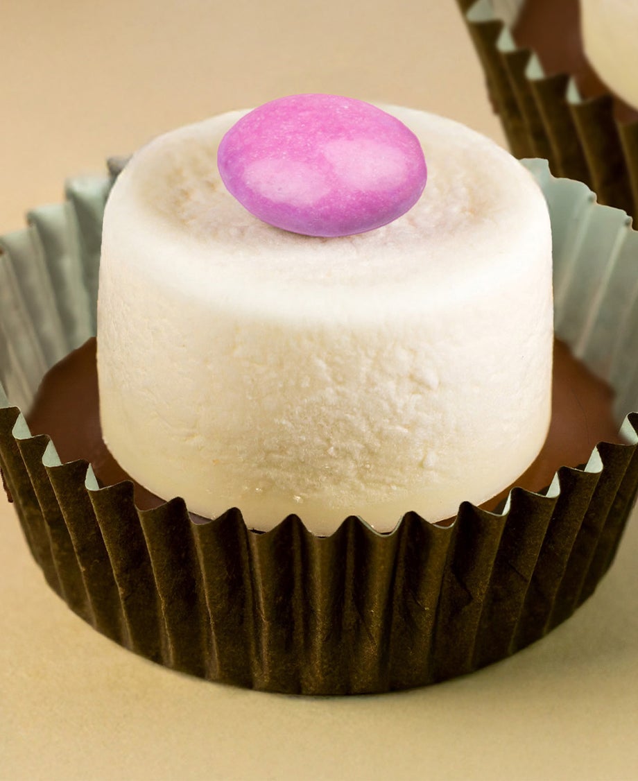 Marshmallow Top Hat consisting of a marshmallow with a melted chocolate base topped with a single Smartie, in a cupcake cas