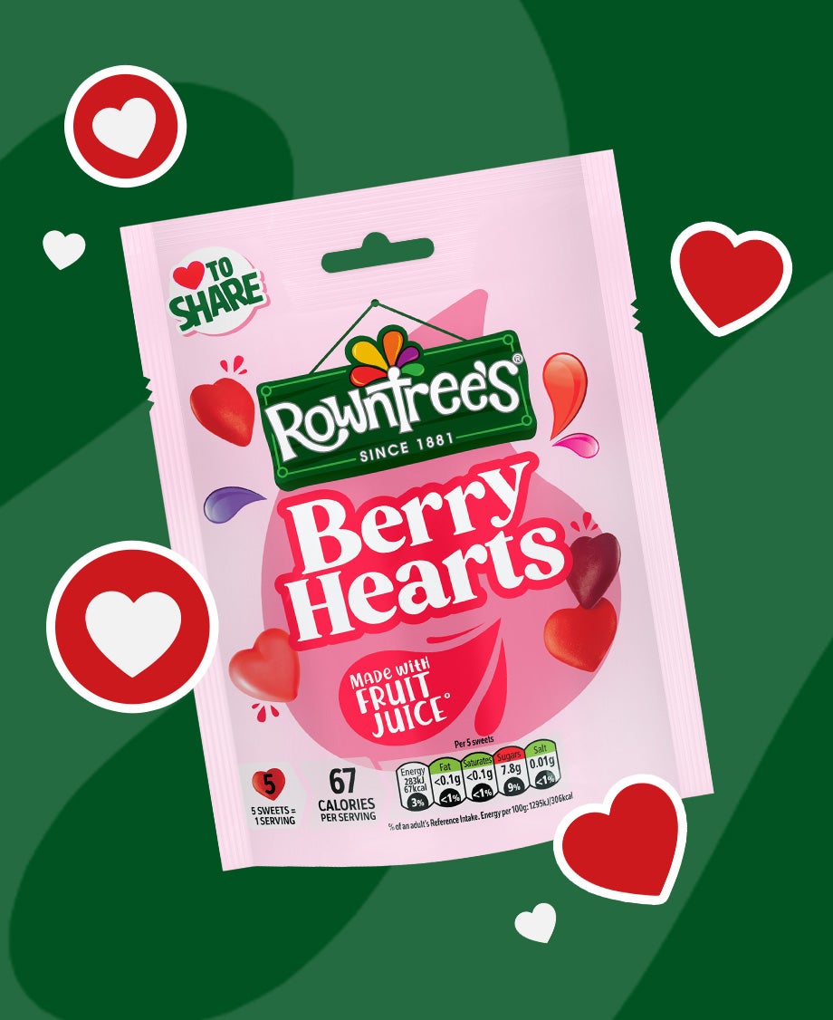 Sharing Bag of Rowntree’s Berry Hearts sweets on a dark green background 