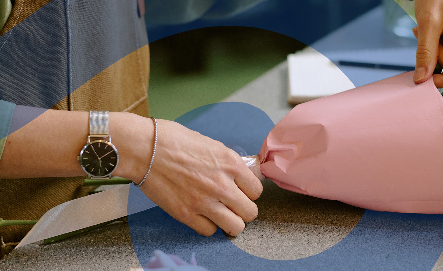 Close-up shot of a woman tying up a bouquet 
