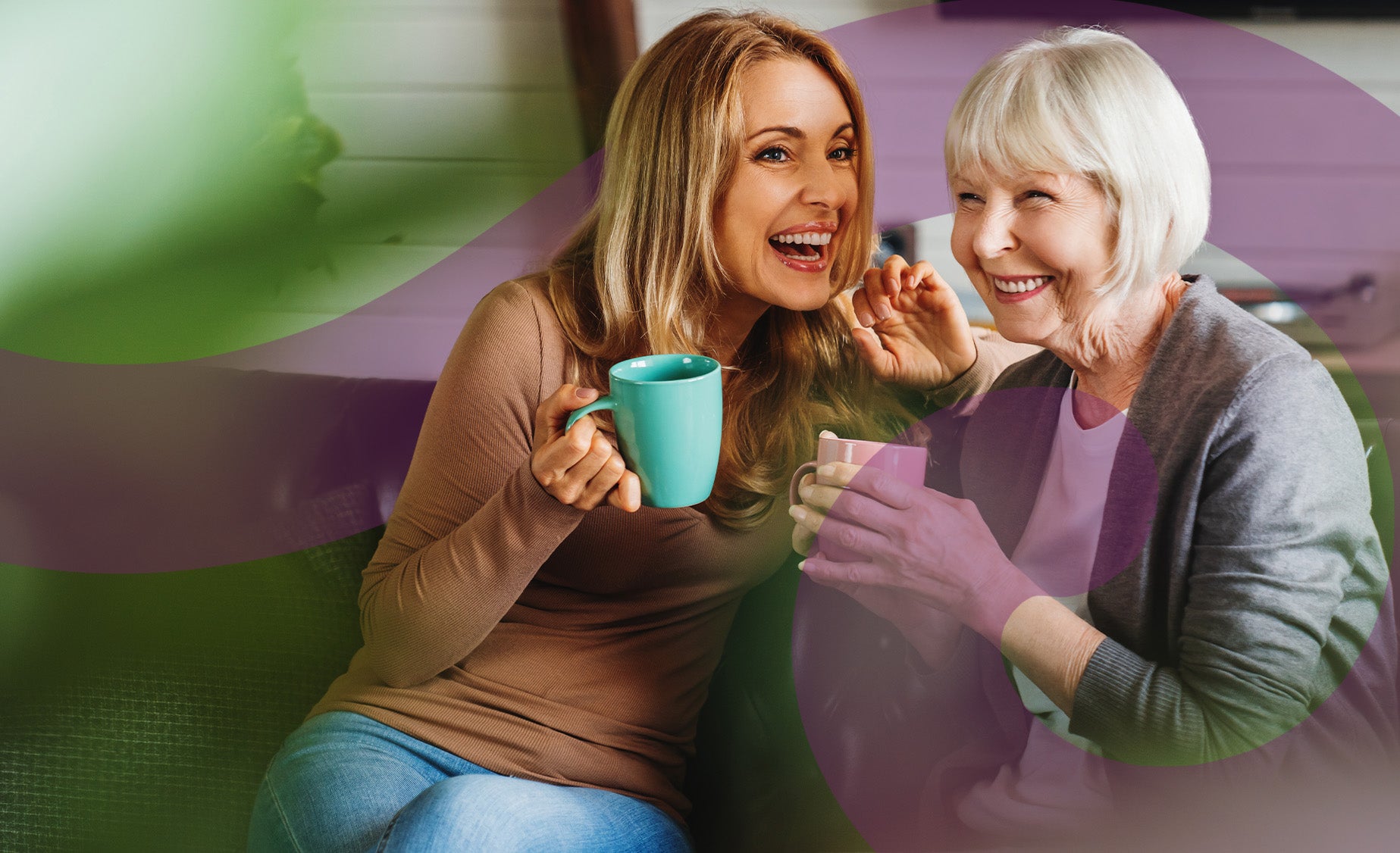 A woman sharing a cup of tea and a giggle with her mother 