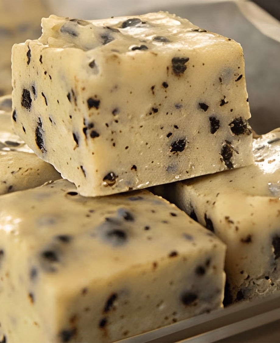 Blocks of Milkybar white chocolate fudge made with crumbled cookies throughout 