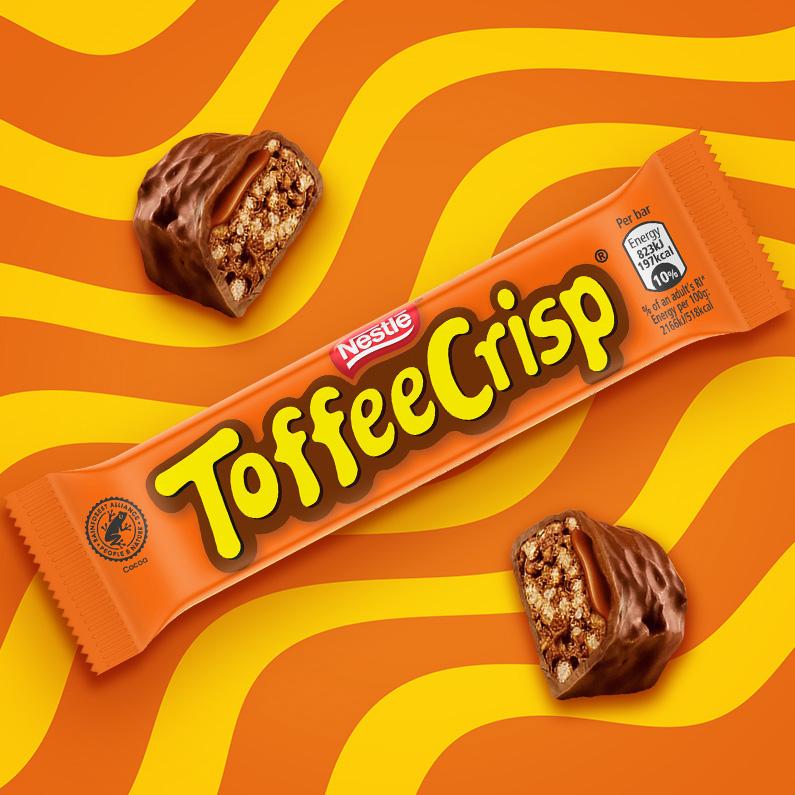 Toffee crisp bar displayed on a vibrant orange background, highlighting its texture and packaging.
